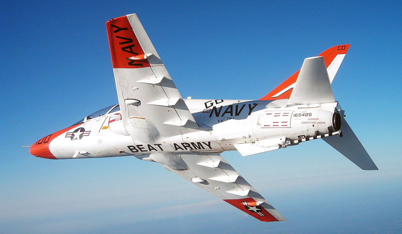 A T-45C Goshawk assigned to Training Air Wing One breaks away from a formation to reveal an underlying message.