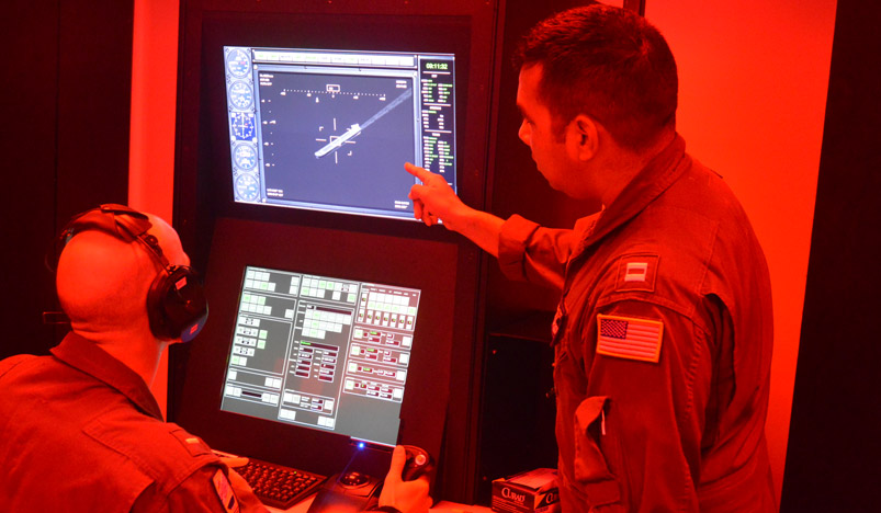 LT Grisham conducts pre-flight checks before a training flight at Navy Aerospace Medical Institute (NAMI).