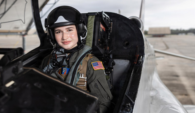 Naval Flight Officer posing in aircraft